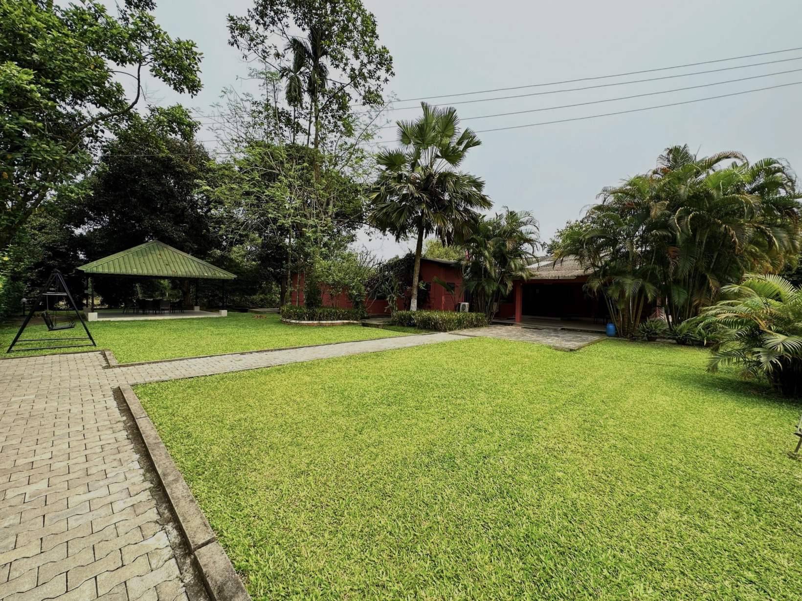 Lawn, gazebo and swing at Chai Seed Resorts