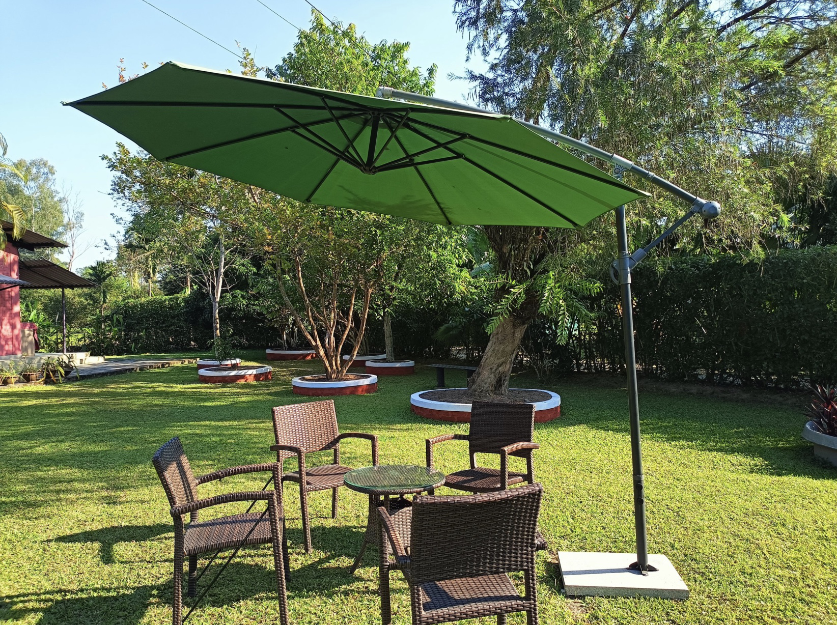 Garden seating area under a large umbrella